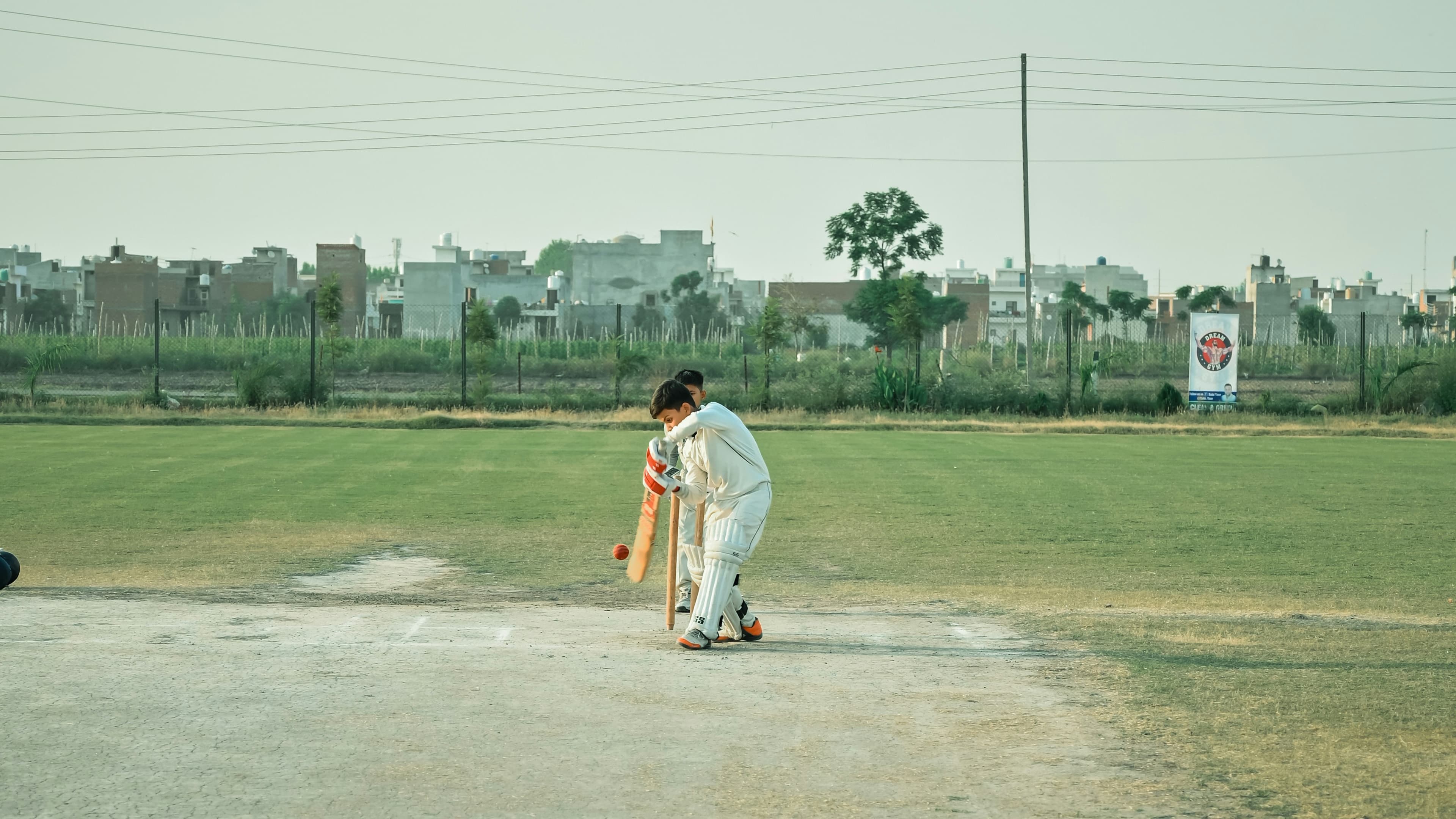 Solo batsman on a cricket pitch